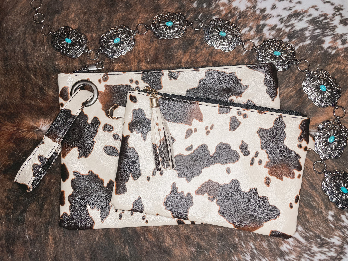 Cowprint clutch bags