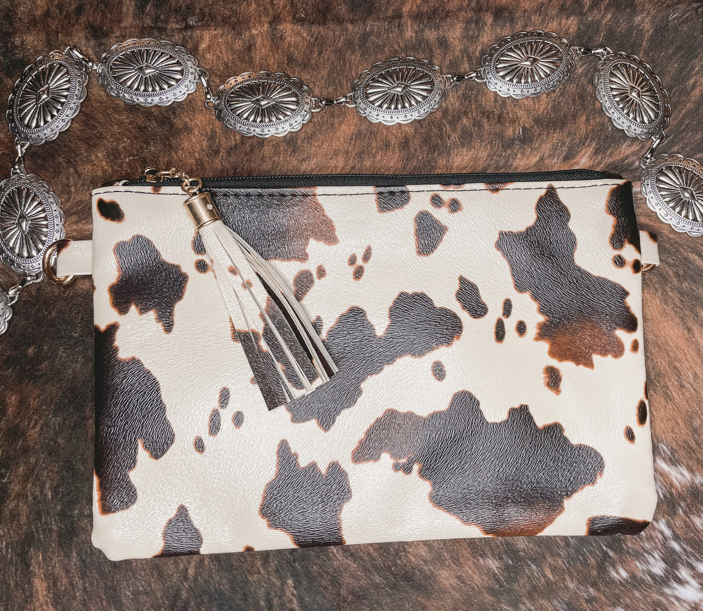 Cowprint clutch bags